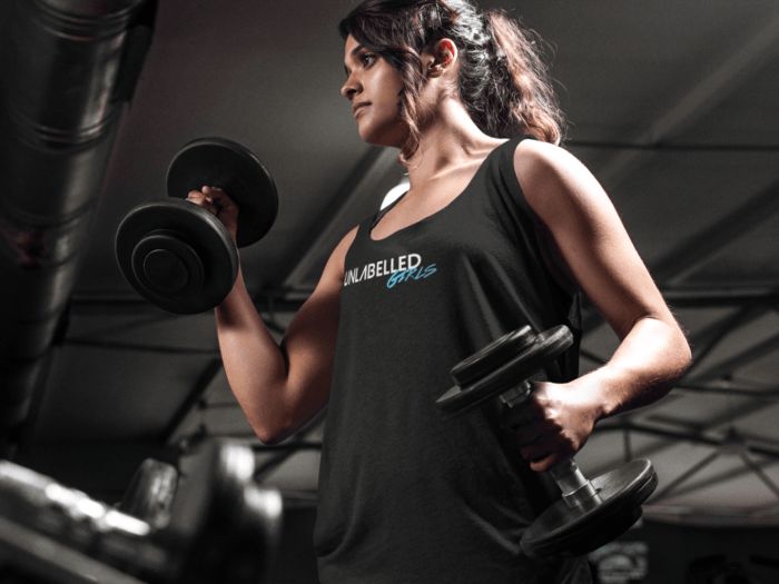 woman lifting weights at the gym tank top mockup a7625