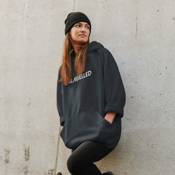 mockup of a woman in an oversized hoodie with a street style leaning on a wall 40273 r el2 scaled e1609244965398